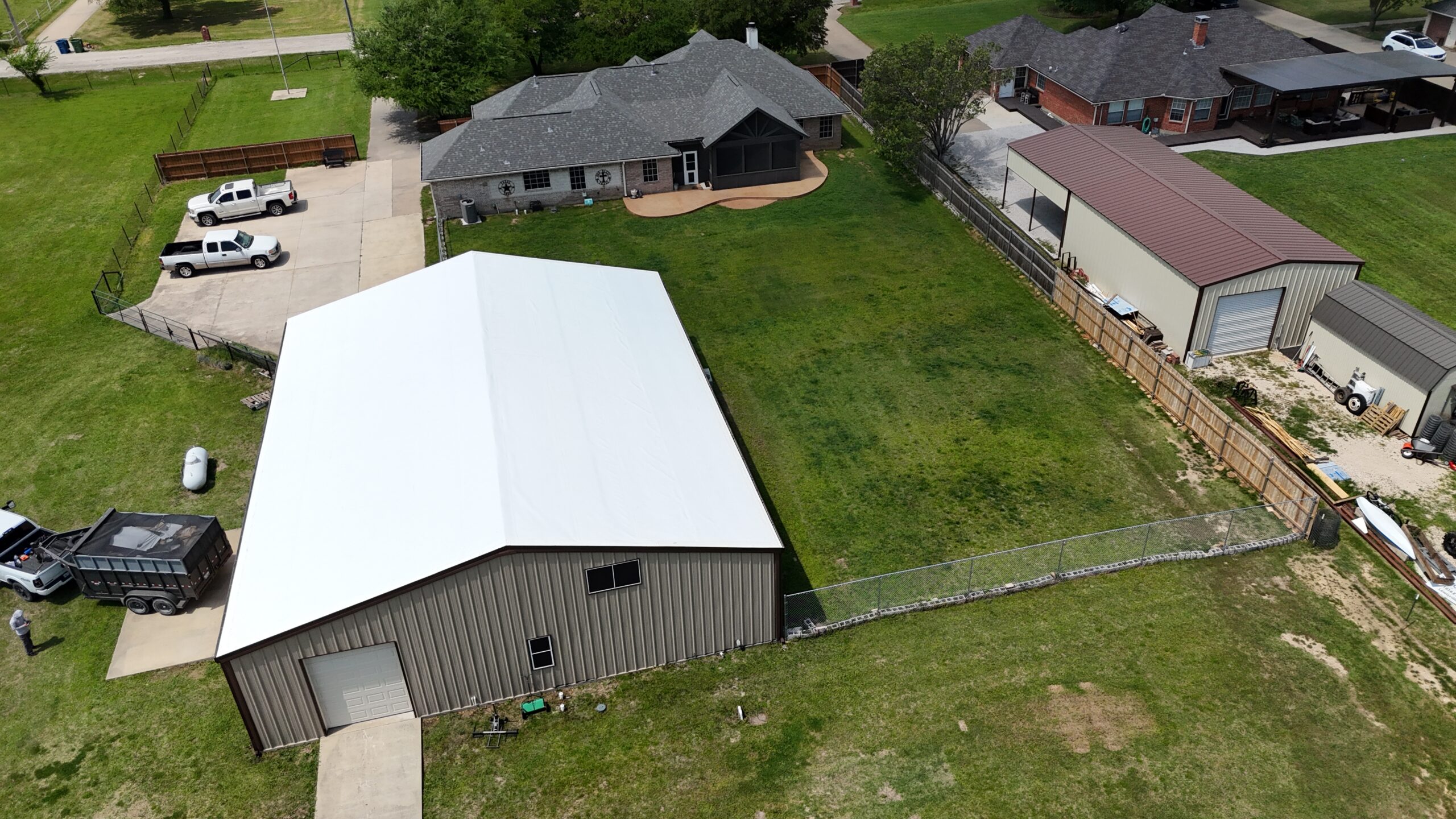 Completed metal roof installed on a residential shop building by Monarch Texas Contracting near Dallas, TX.