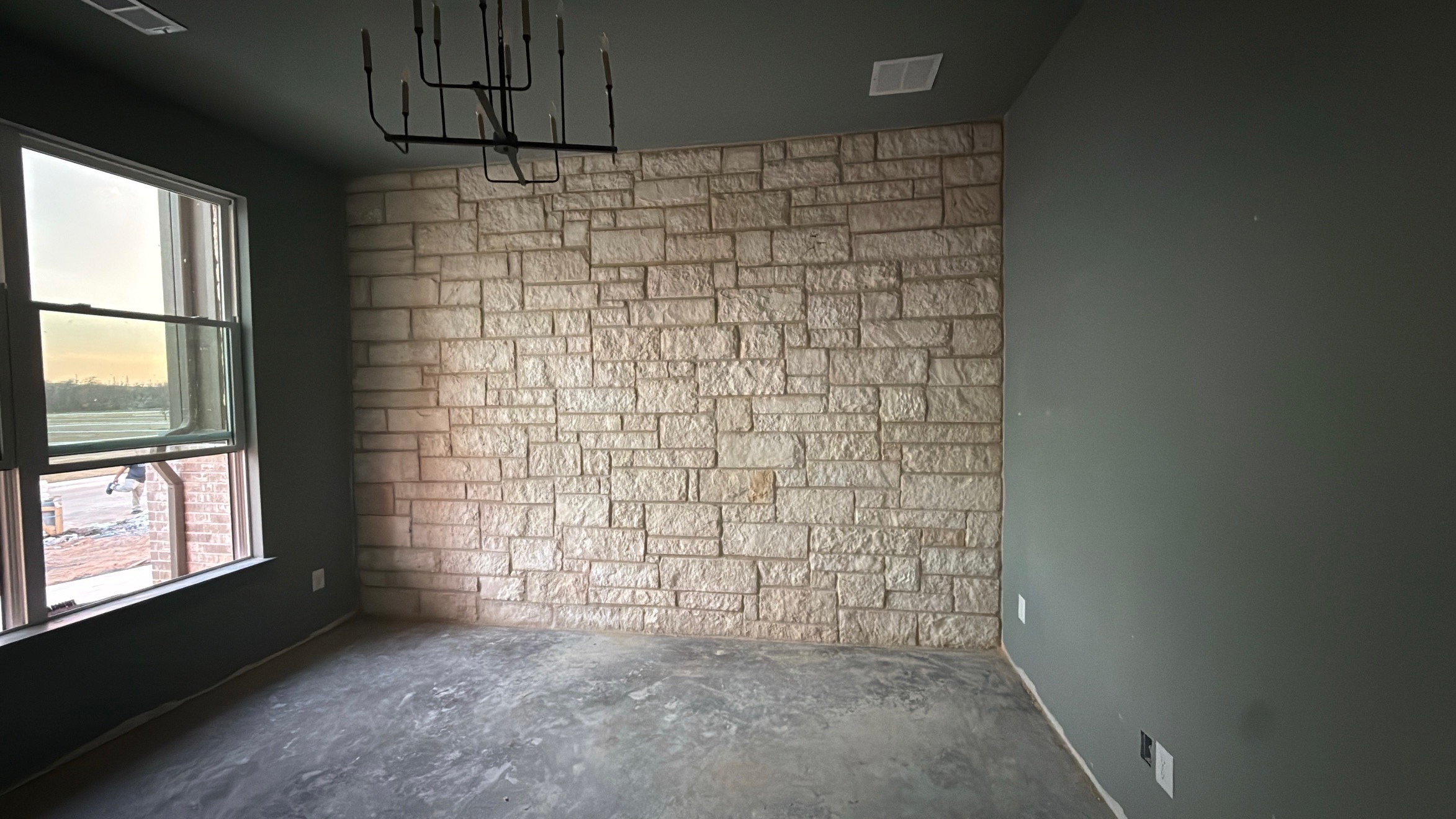 Completed natural stone accent wall installed as part of a custom interior remodeling project.