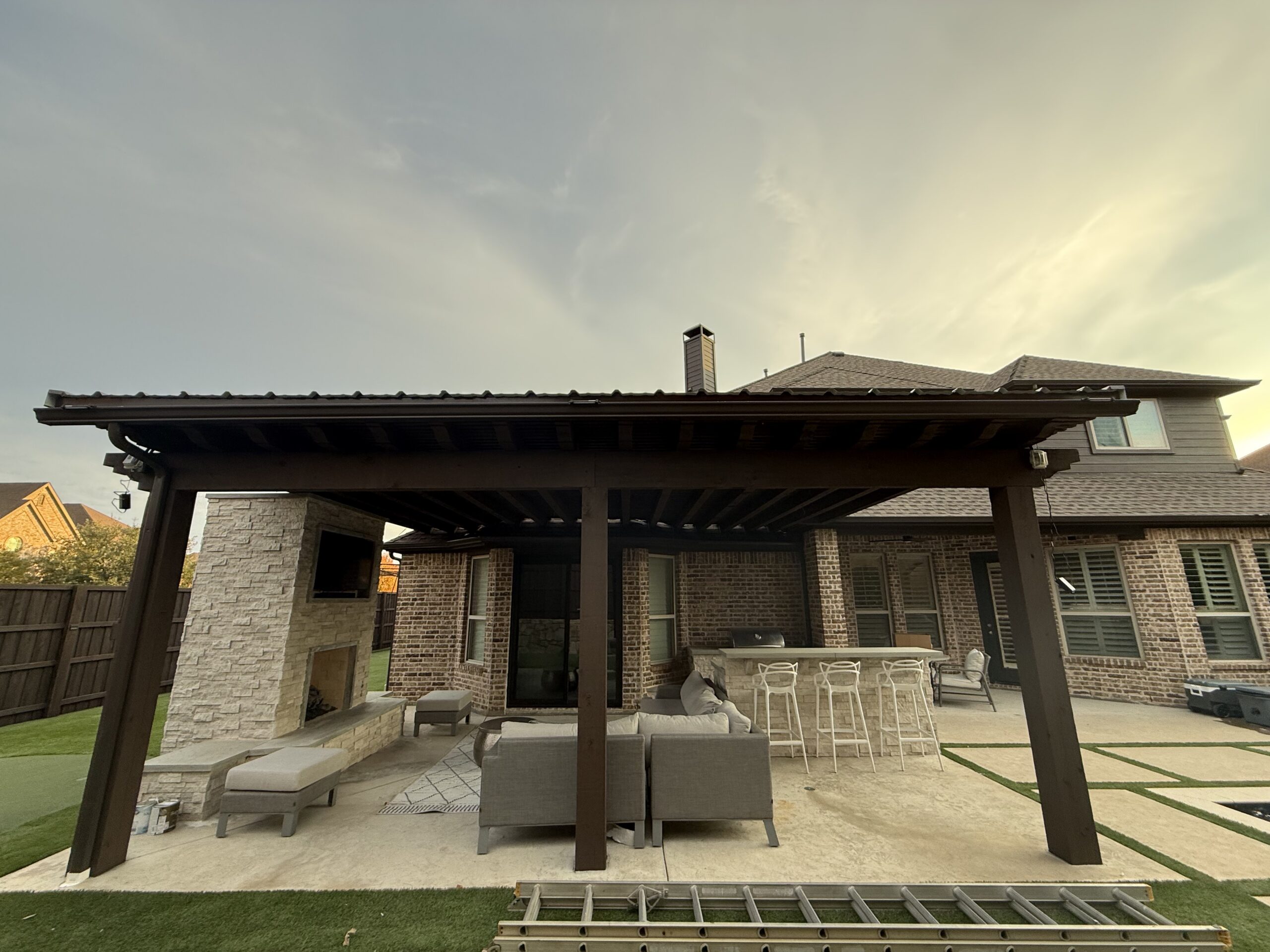 Covered patio featuring a professionally installed standing seam metal roof in Dallas Fort Worth.